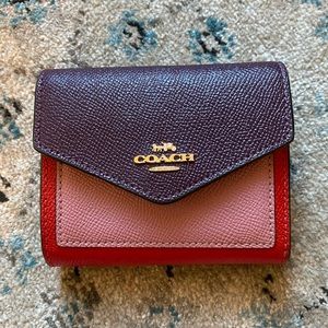 Multi colored Coach trifold wallet